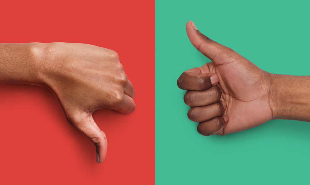 Collage of black hands showing thumb up and down at green and red background, copy space. Approval and disagreement gestures. Mockup for survey or poll